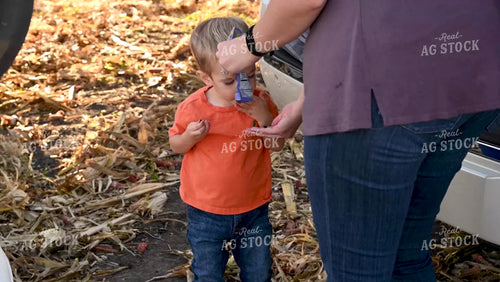Family Enjoying Harvest Meal in the Field - 548