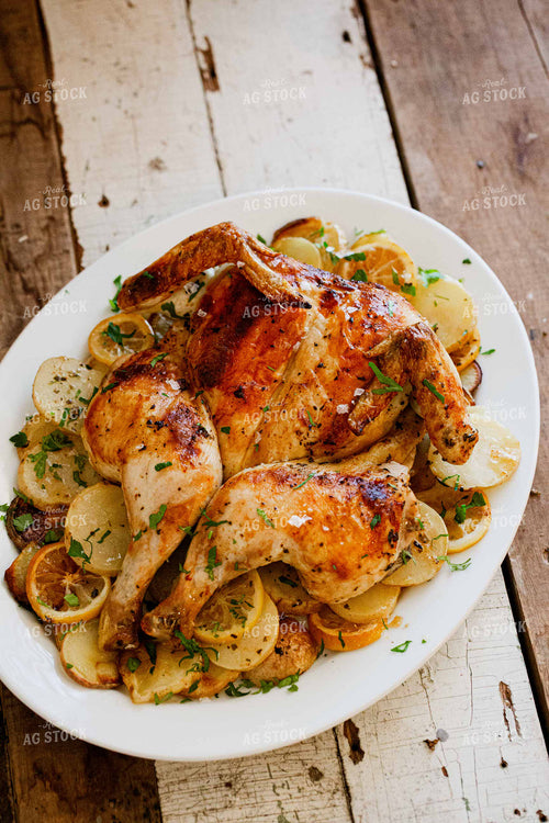 Roasted Whole Chicken on Bed of Potatoes 134029