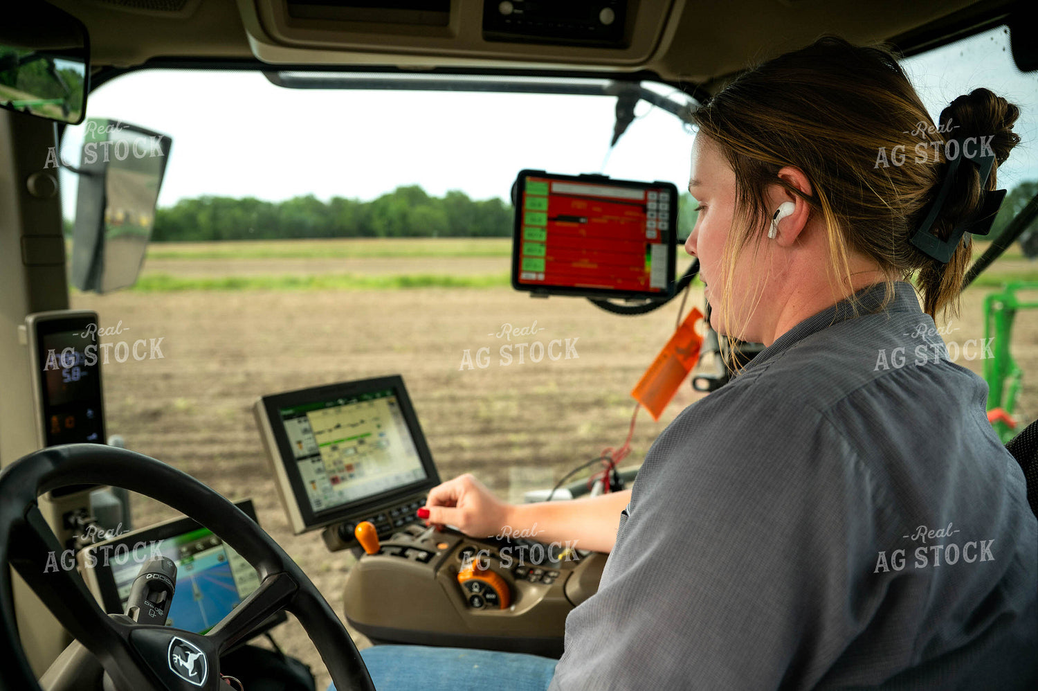 Female Farmer in Tractor Cab 115668