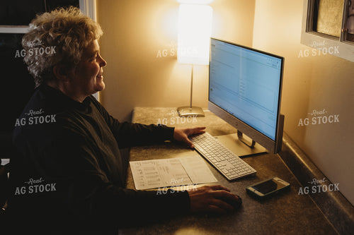 Farmer Using Computer for Farm Accounting 3700