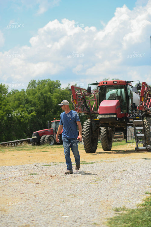 Farmer Walking by Sprayer 191231