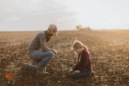 Farmer Checking Seed Depth with Daughter 8228