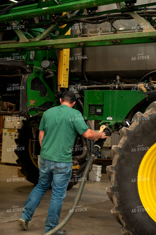 Farmer Filling Self-Propelled Sprayer 115737