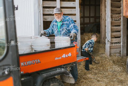 Farmer and Farm Kid Doing Chores 7396