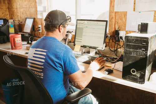 Male Farmer Working on Computer 7021
