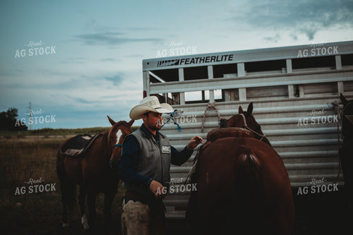 Rancher with Horses Near Livestock Trailer 6439