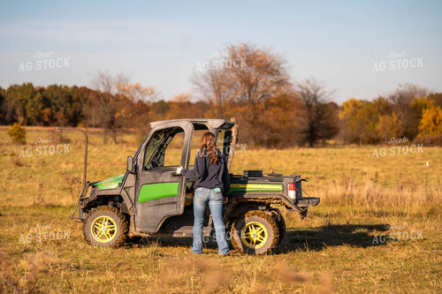 Female Farmer Getting into Side by Side 115462