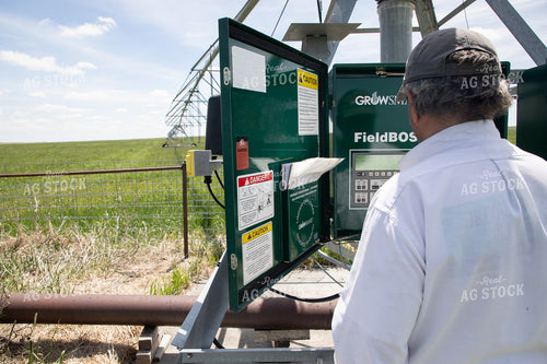 Farmer Checking Pivots 117056