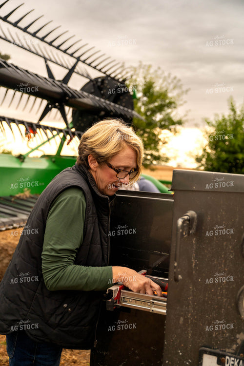 Female Farmer Getting Tools out of Service Truck 115412