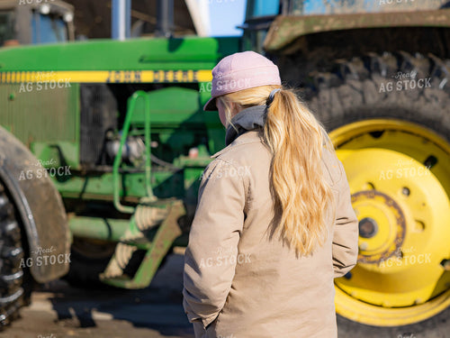 Rancher Walking Across Farm 70190