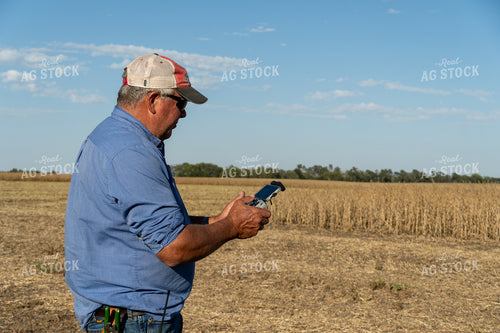 Farmer Flying Drone in Field 65087