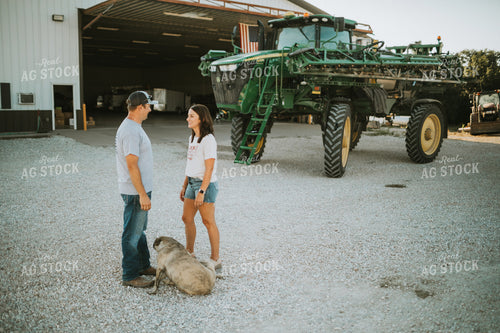 Farmer and Farm Wife Talking Outside Shop 6237