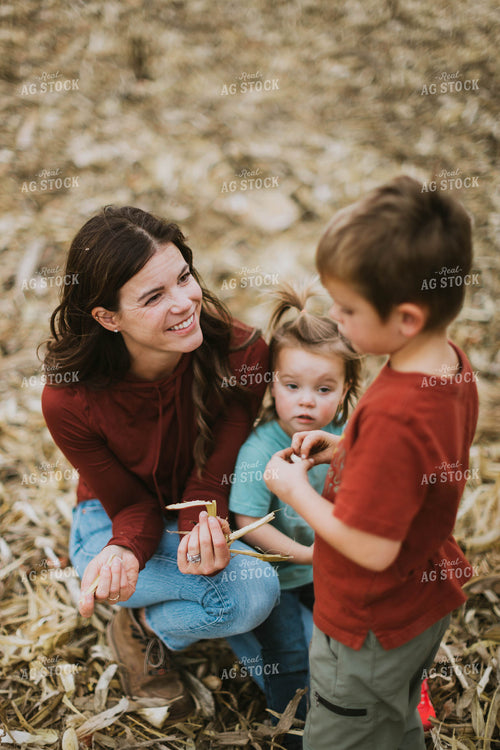 Female Farmer and Kids Playing in Cornfield 8618