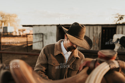 Cowboy Saddling Horse 61180