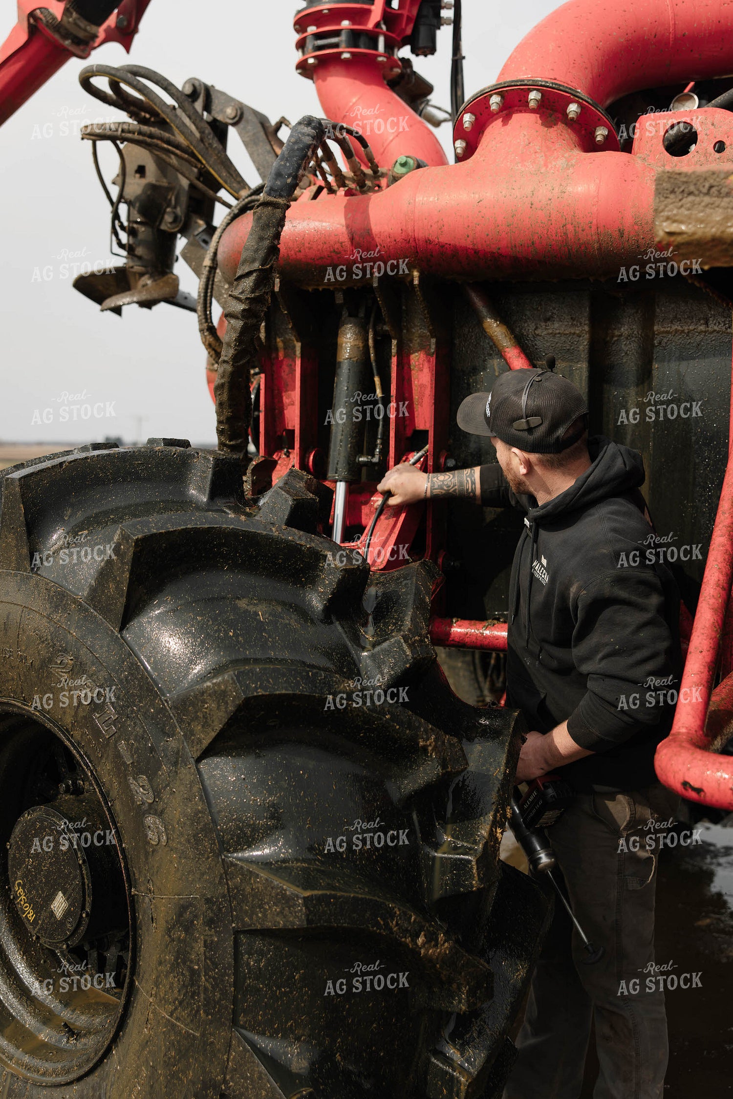 Farmer Greasing Manure Crawler 152699