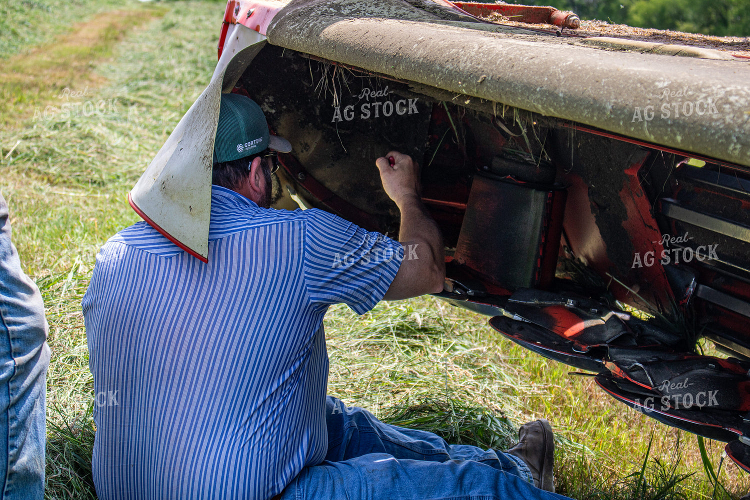 Farmers Fixing Hay Cutter 214140
