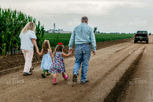 Farmers and Farm Kids Walking on Gravel Road 218068