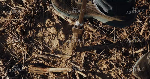 Pushing Soil Sample Probe into the Ground - Close Up 3926