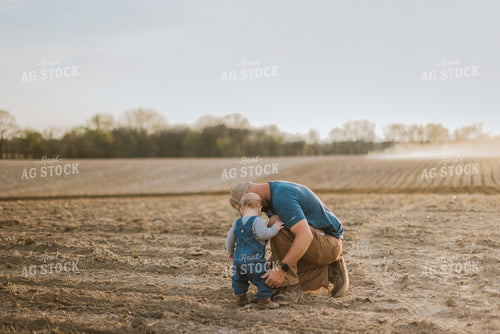 Farmer and Farm Kid in Field 7427