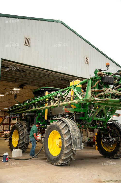 Farmer Filling Self-Propelled Sprayer 115749