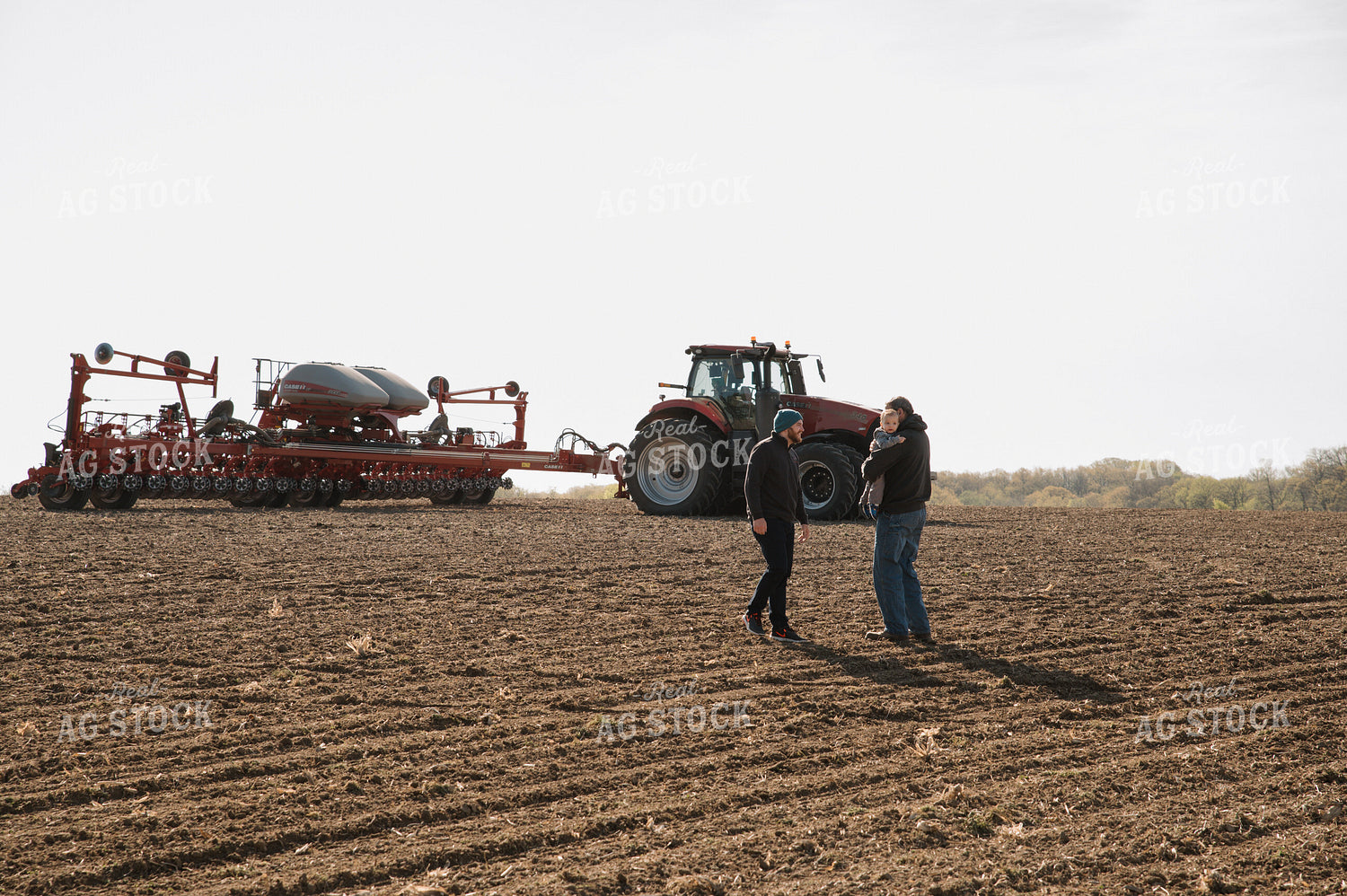 Farm Family in Field During Planting 26050