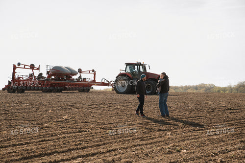 Farm Family in Field During Planting 26050