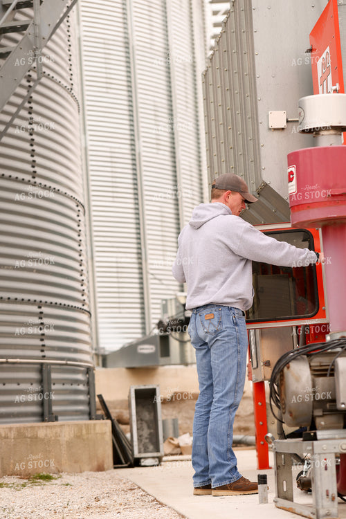 Farmer Checking Grain Dryer 161132