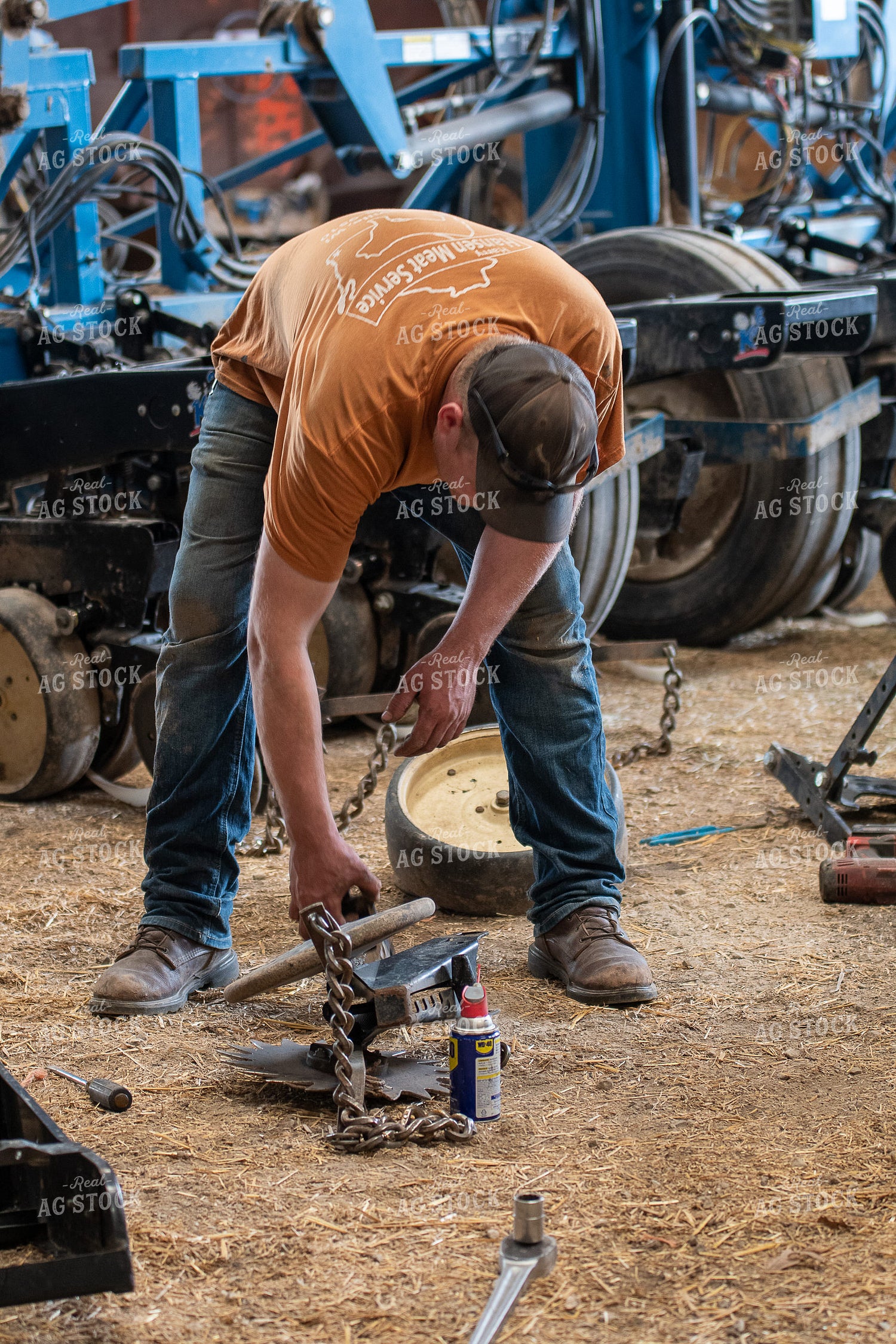 Farmer Working in Shed 50265