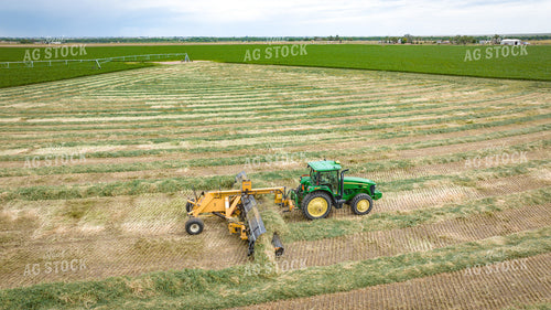 Tractor with Merger in Hay Field 56414