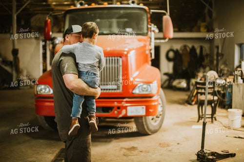 Farmer with Farm Kid in Shop 5136