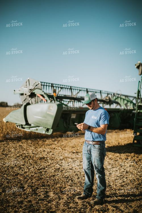 Farmer on Phone in Field 7136