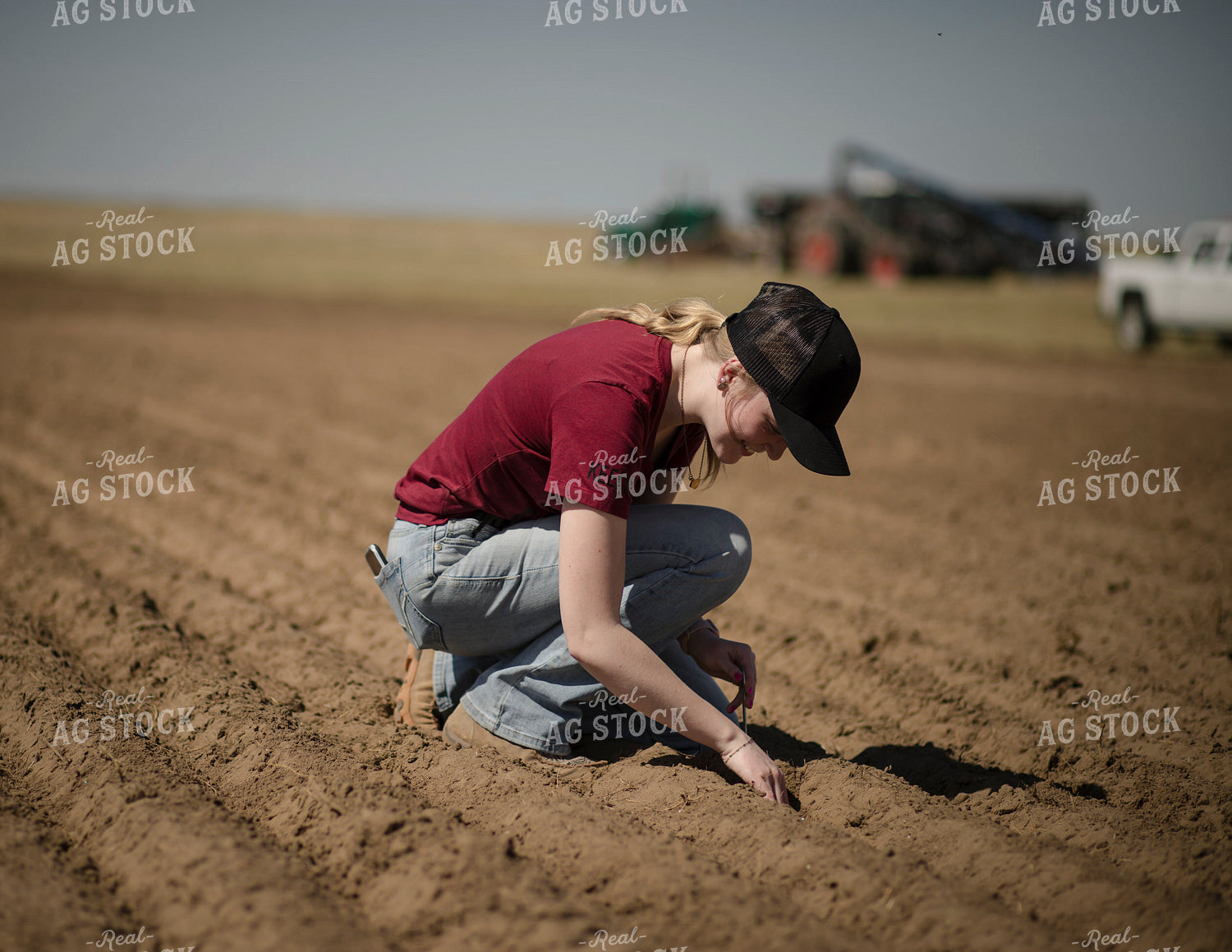Female Farmer Checking Seed Depth 135077