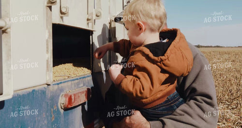Farm Kid Pointing at Combine 3958