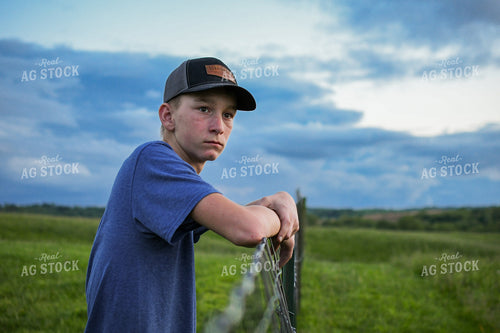 Farm Kid Leaning on Fence 191159