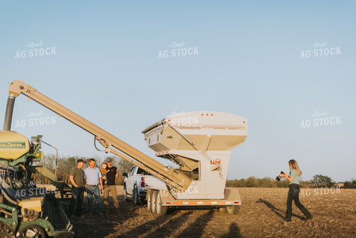 Farm Wife Takes Pictures of Farmers Next to the Planter and Seed Tender 7706