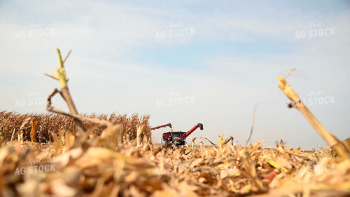 Combine Unloading Corn into Auger Wagon on the Go 25608