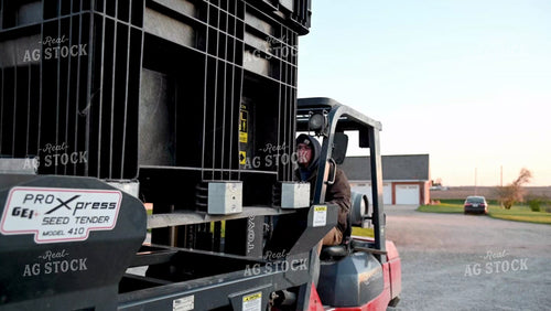 Loading the Seed Tender with a Skidsteer - 057