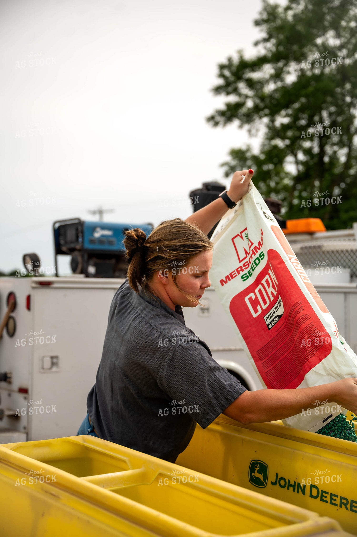 Female Farmer Filling Planter 115635