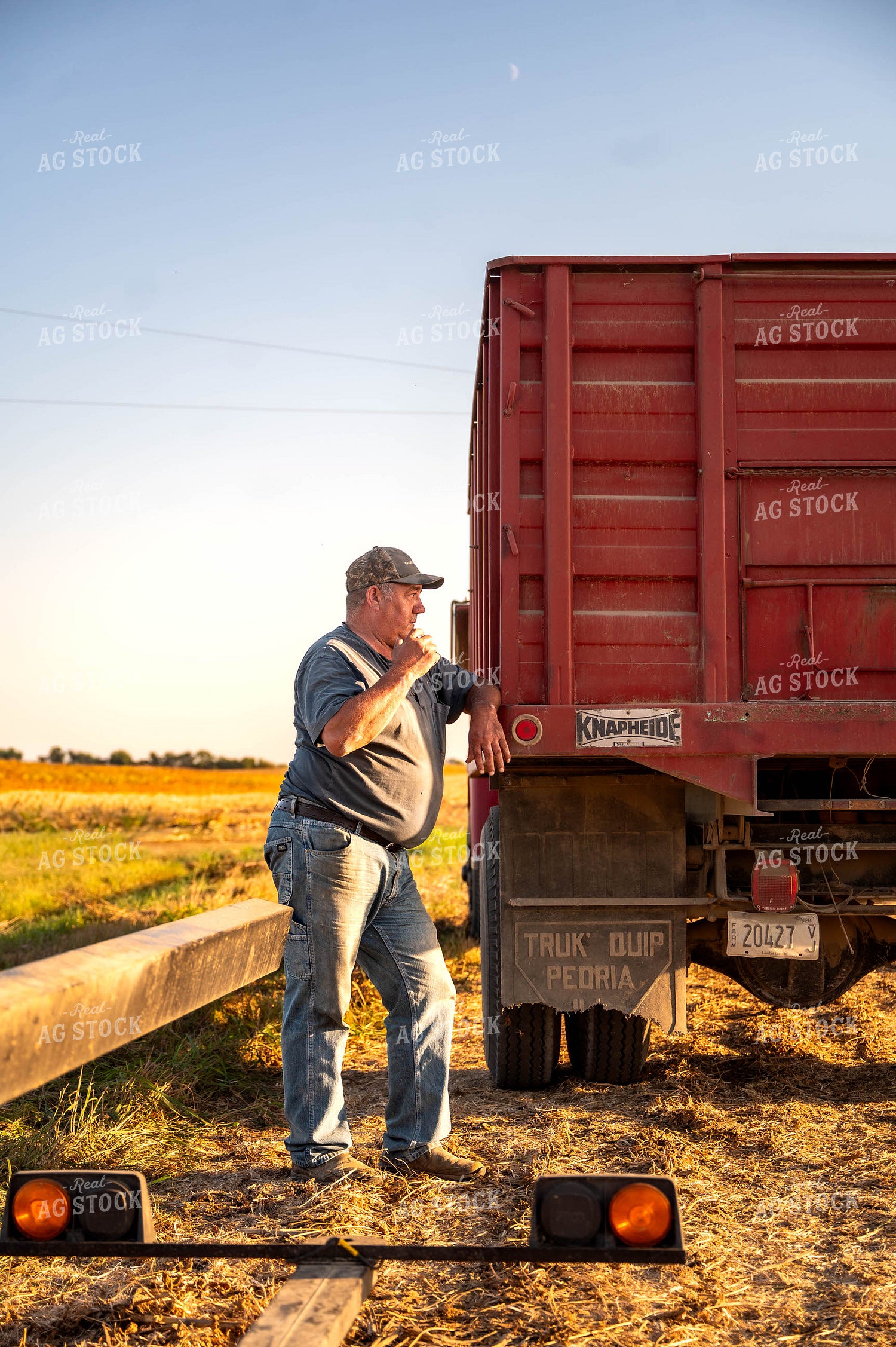 Farmer Leaning on Truck 115850