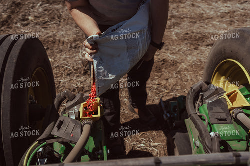 Farmer Filling Planter for Test Plot 196119