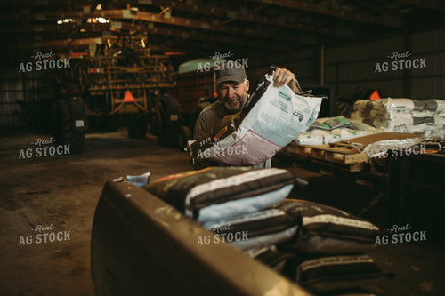 Farmer Loading Seed Bags 4080