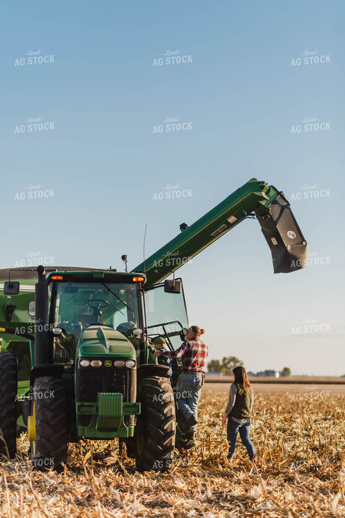 Farm Family Climbing into Tractor 115128