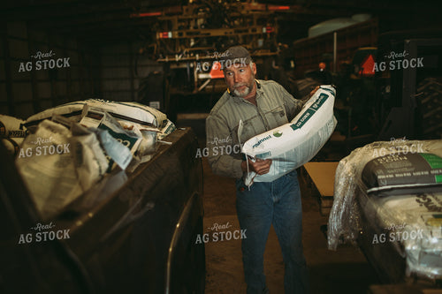 Farmer Loading Seed Bags 4078