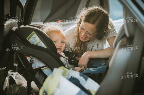 Farmer Getting Toddler out of Car 4808