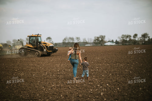 Farm Mom Taking Kids Out to Tractor During Planting 5636