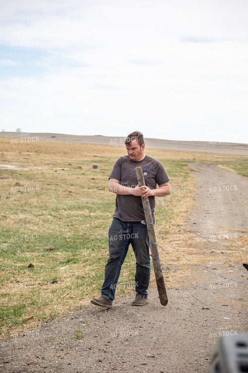 Farmer Putting Up Fence 155415