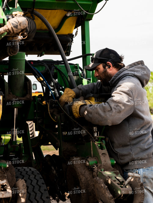Farmer Working on Planter 185220