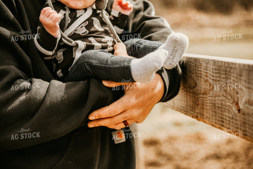 Farmer Rancher Holding Baby 64125