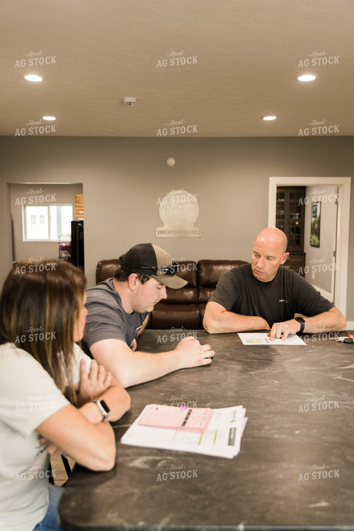 Farmers Review Seed Orders in Farm Office 7619