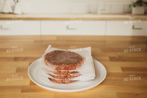 Raw Hamburger Patties on Plate on Kitchen Countertop 67326